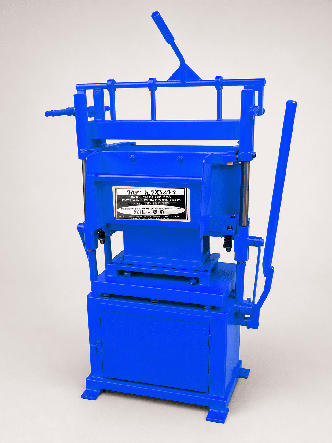 Blue manual hollow block machine with Alem Engineering sticker